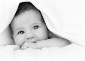 Image of baby under a blanket